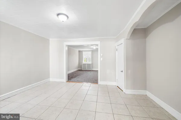 a view of an empty room and window