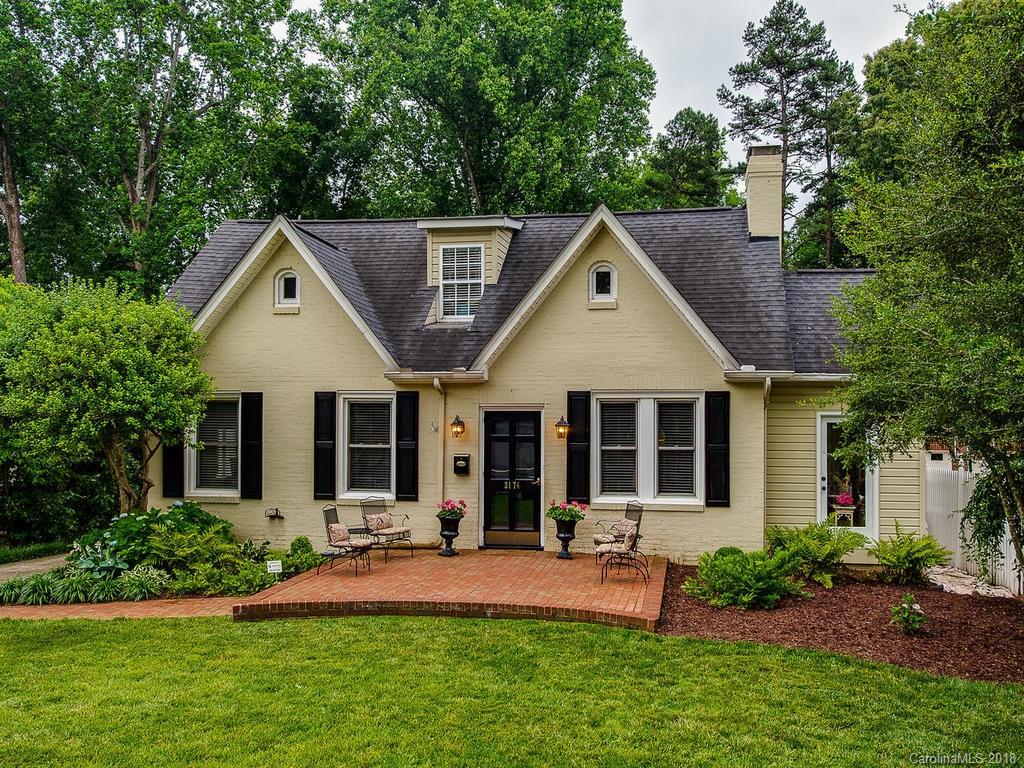 a front view of a house with a yard and porch