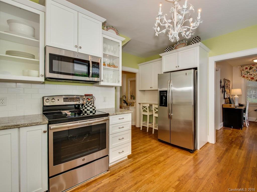 2174 Colony Road Charlotte, NC 28209 - Photo 11 of 24 a kitchen with stainless steel appliances granite countertop a refrigerator microwave and stove