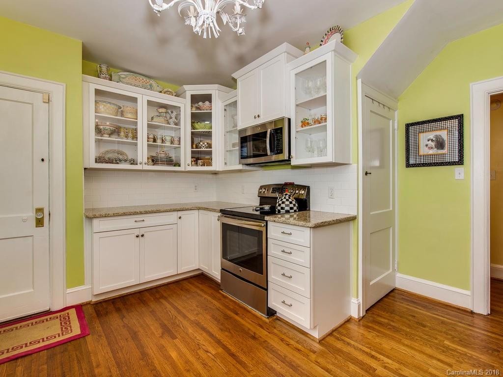 2174 Colony Road Charlotte, NC 28209 - Photo 12 of 24 a kitchen with stainless steel appliances granite countertop a stove and a microwave