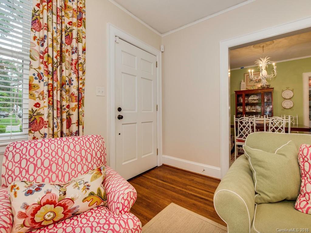 2174 Colony Road Charlotte, NC 28209 - Photo 3 of 24 a bedroom with a bed and a chair