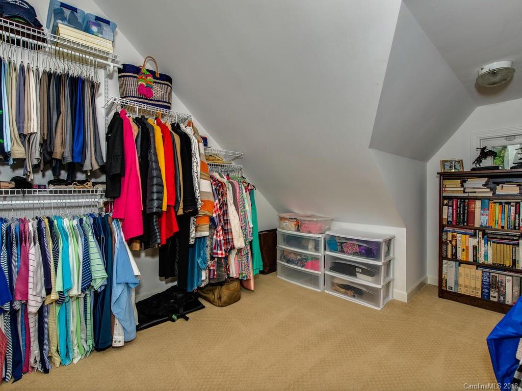2174 Colony Road Charlotte, NC 28209 - Photo 21 of 24 a view of walk in closet with clothes and shoes