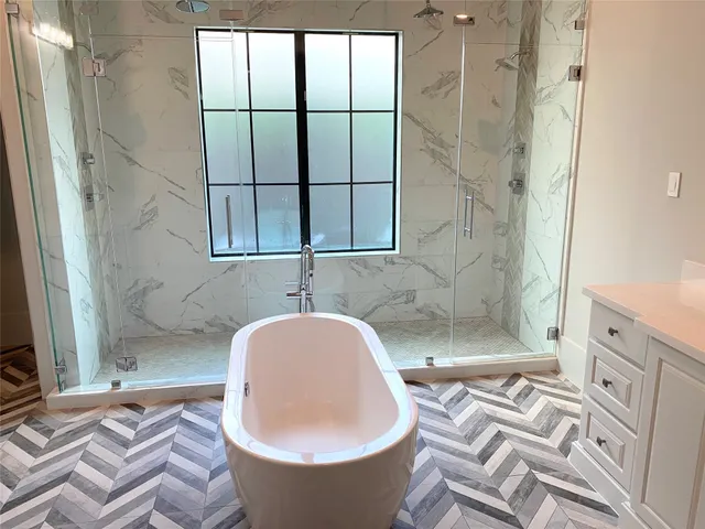 a white bath tub sitting in a bathroom
