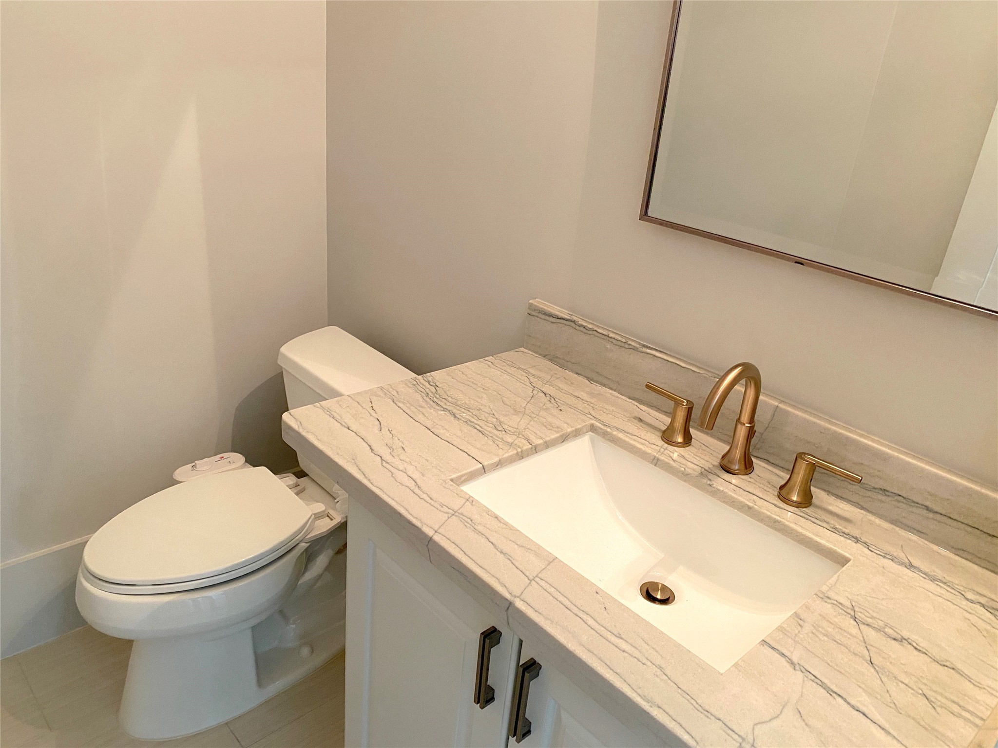 4642 Devon Street Houston, TX 77027 - Photo 21 of 39 a bathroom with a sink and a toilet