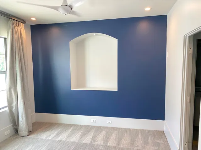 a bathroom with a toilet and a bathtub