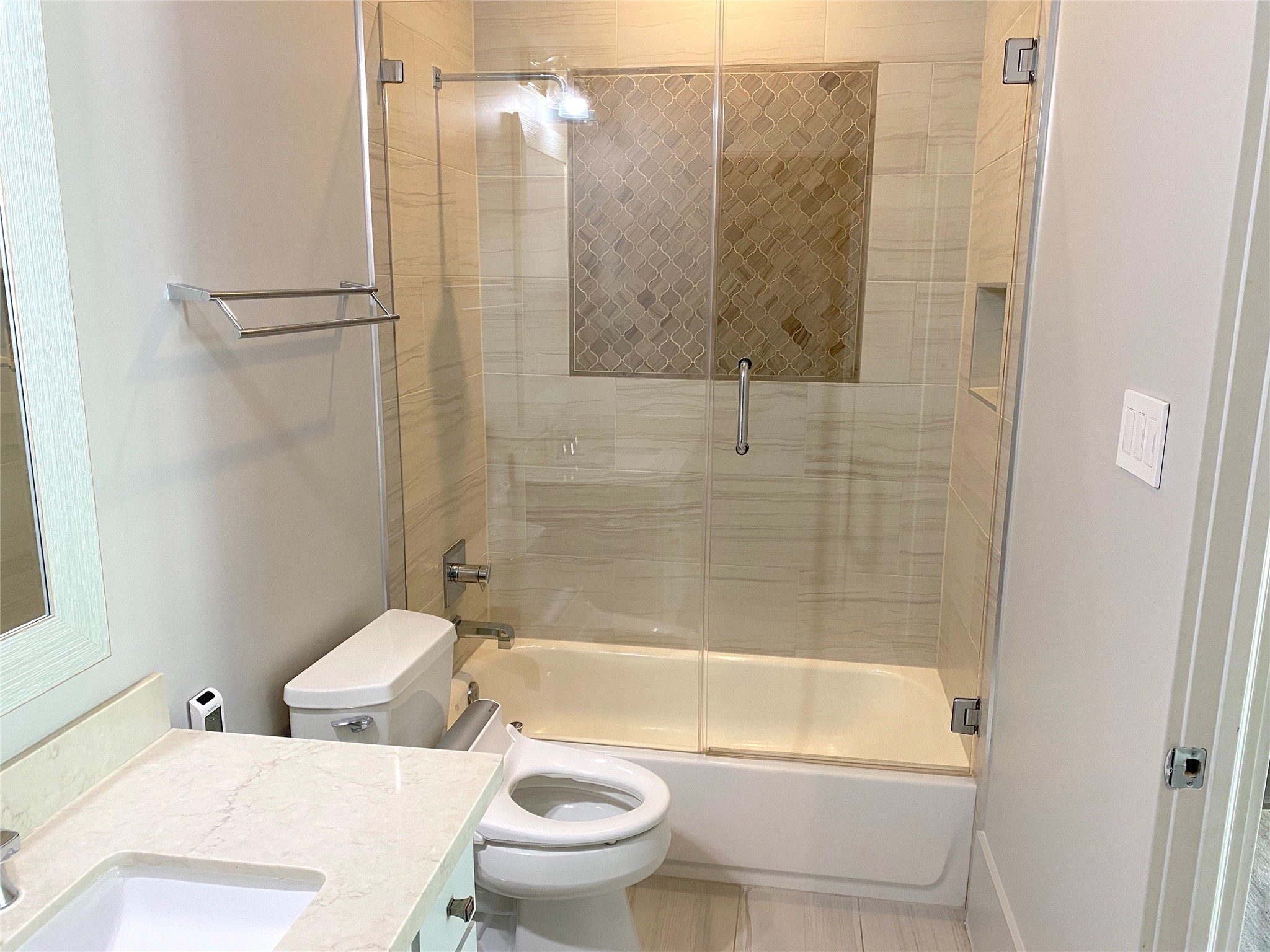 4642 Devon Street Houston, TX 77027 - Photo 25 of 39 a bathroom with a toilet and a bathtub