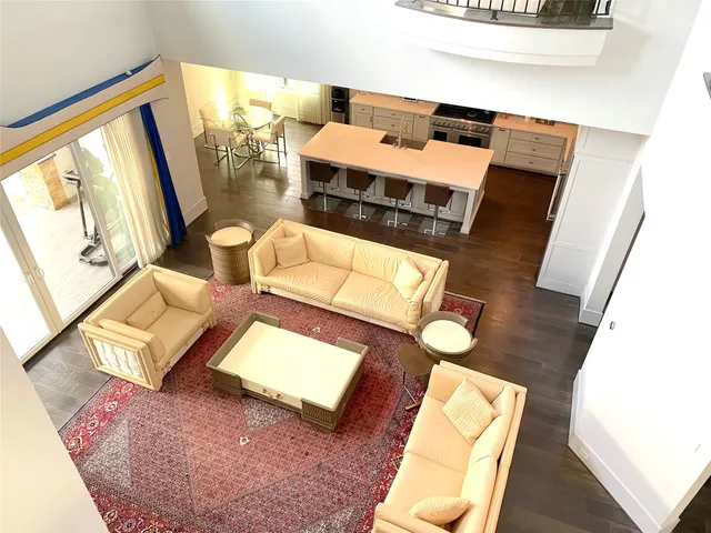 a room with wooden floor and windows