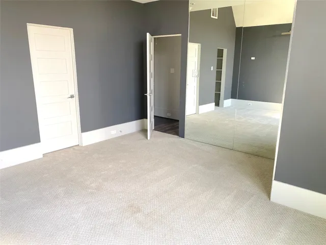 a view of a swimming pool with lawn chairs