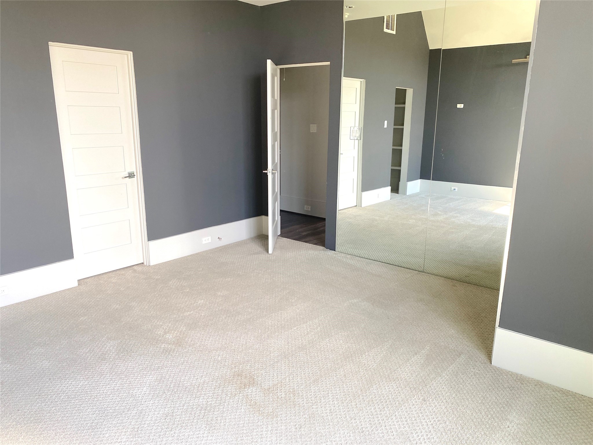 4642 Devon Street Houston, TX 77027 - Photo 32 of 39 a view of an empty room with closet and wooden floor