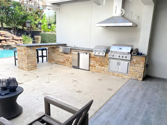 a view of a swimming pool with a patio