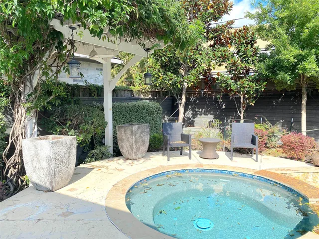 a view of yard with patio