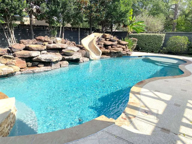 a view of a dining room with furniture and a potted plant