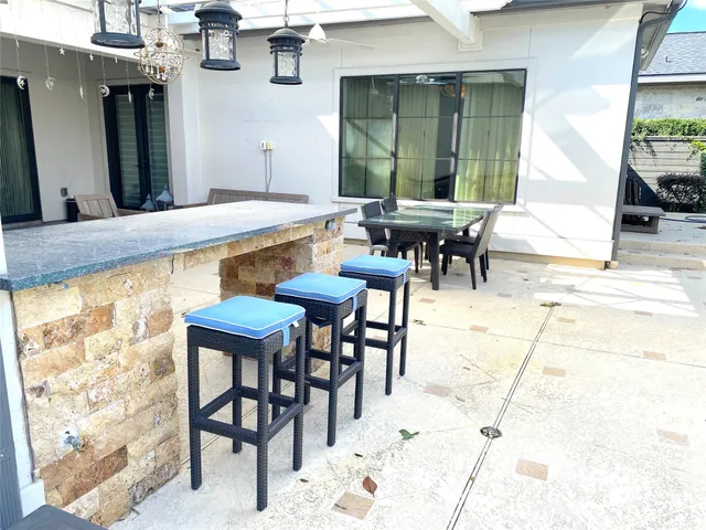 a view of a swimming pool with a patio