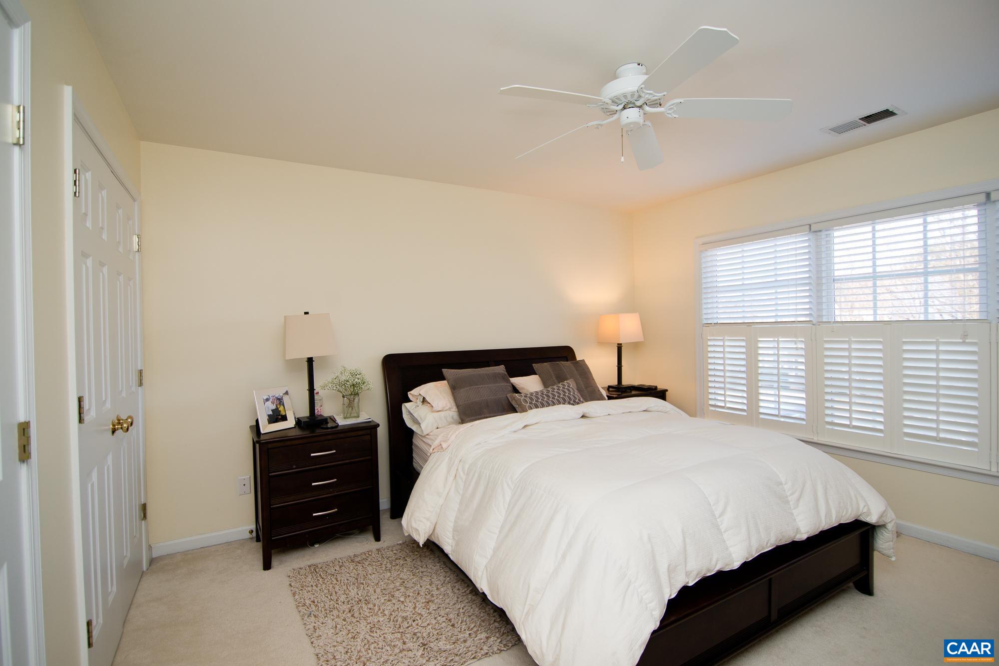 2986 Magnolia Bend Charlottesville, VA 22911 - Photo 14 of 22 a bedroom with a bed and a ceiling fan