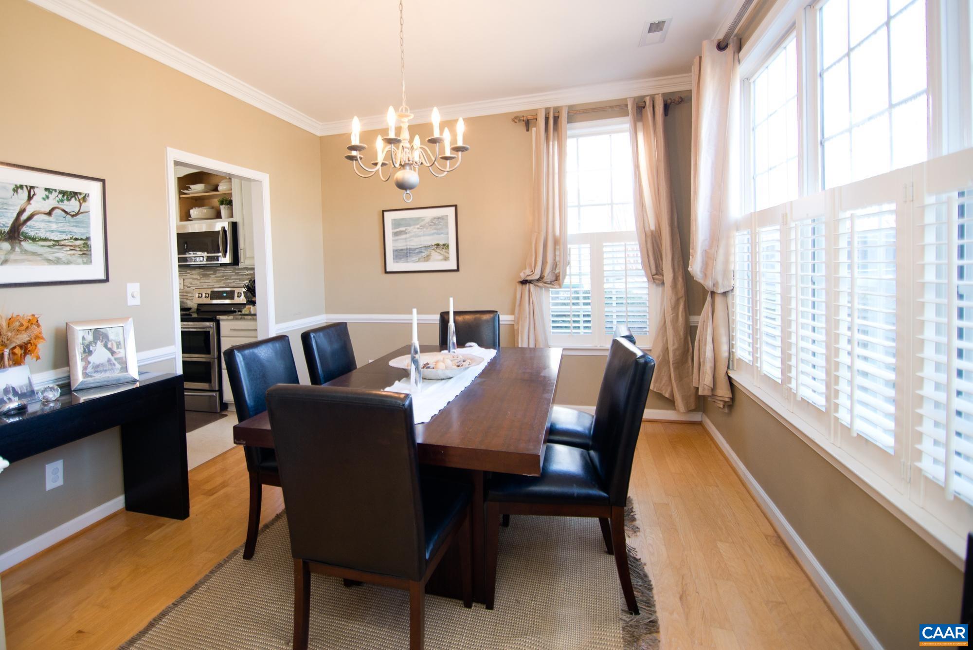 2986 Magnolia Bend Charlottesville, VA 22911 - Photo 4 of 22 a view of a dining room with furniture a chandelier and a window