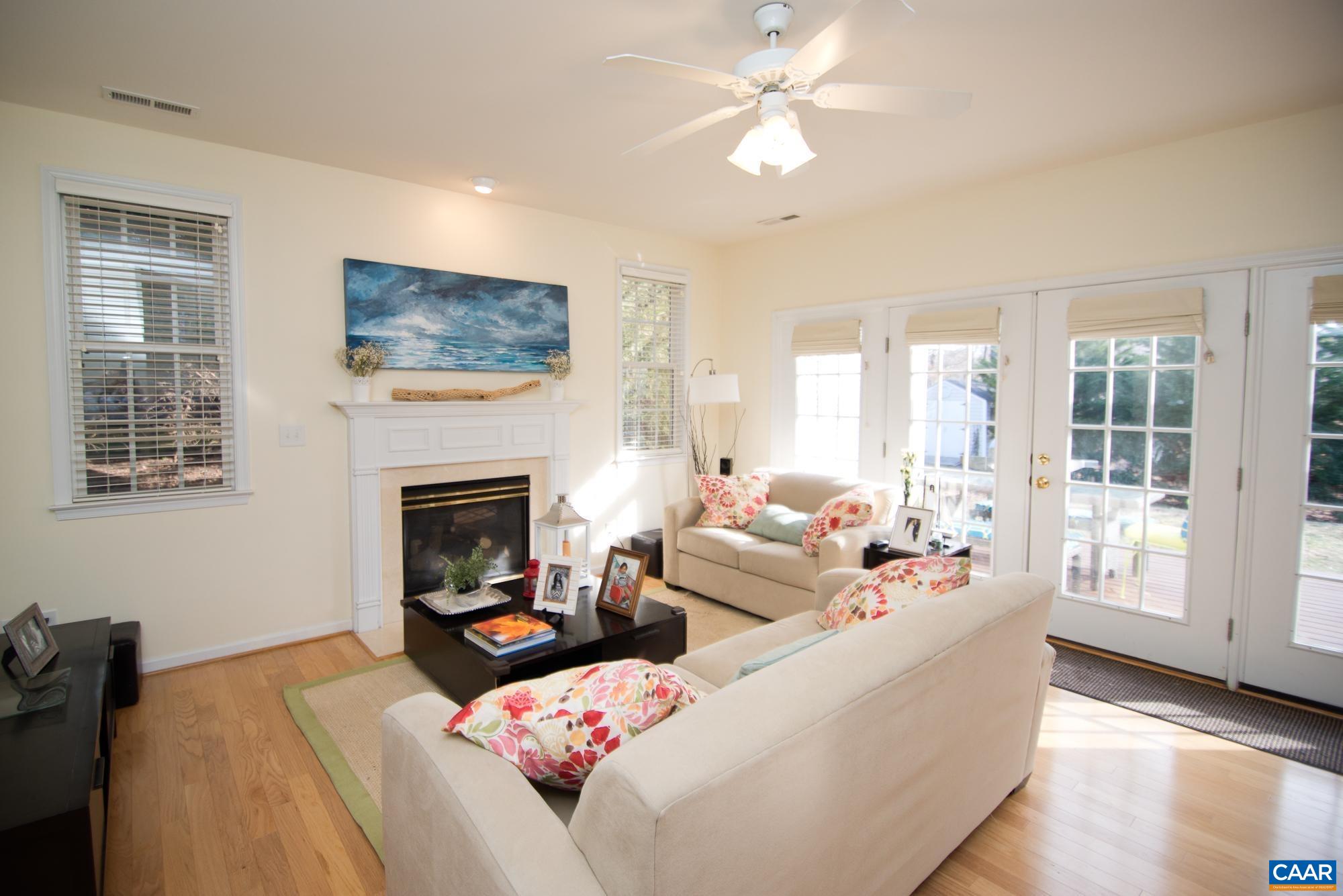 2986 Magnolia Bend Charlottesville, VA 22911 - Photo 5 of 22 a living room with furniture a fireplace and a flat screen tv