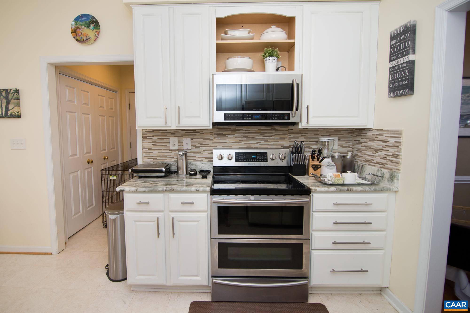 2986 Magnolia Bend Charlottesville, VA 22911 - Photo 8 of 22 a kitchen with a stove and a microwave