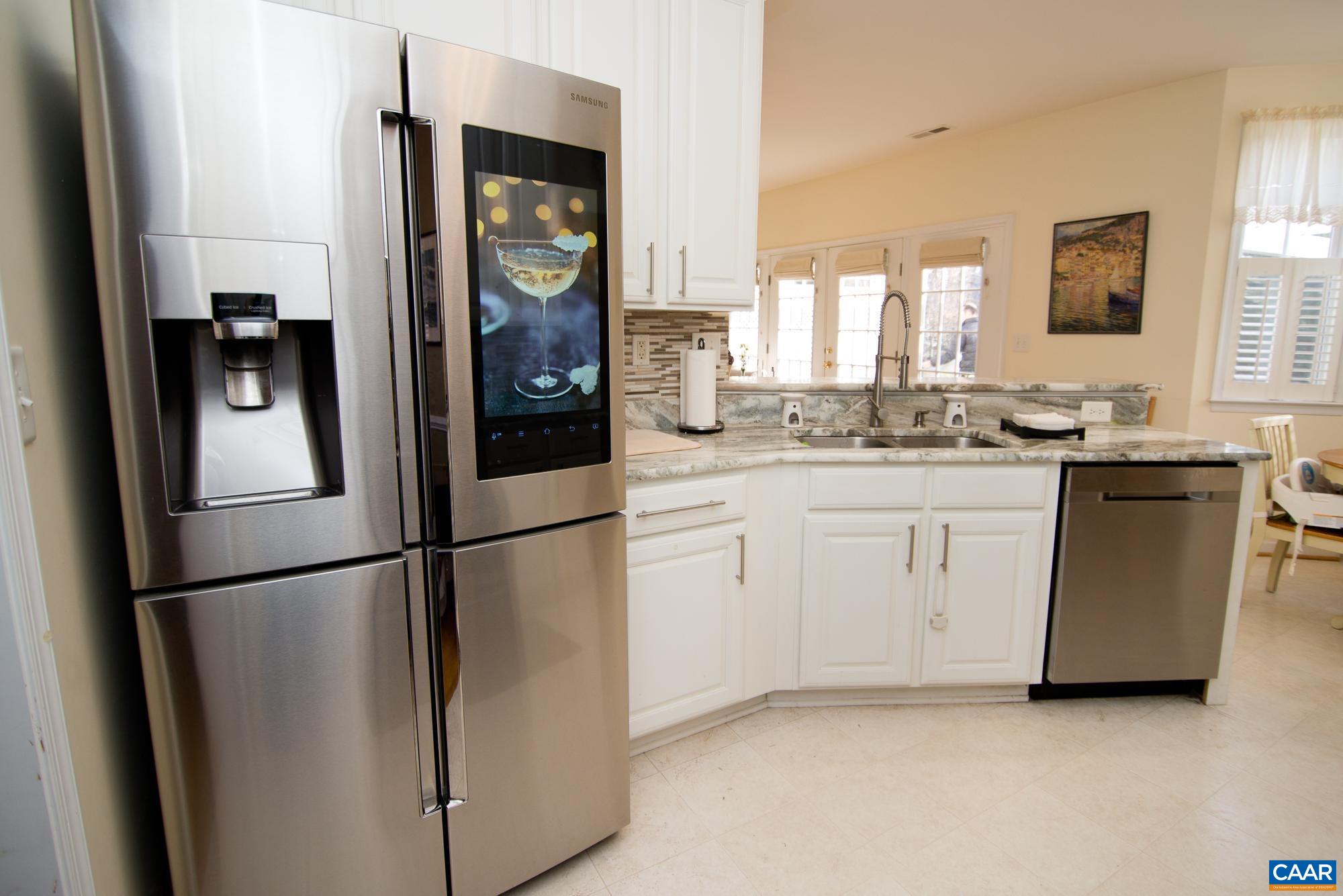 2986 Magnolia Bend Charlottesville, VA 22911 - Photo 10 of 22 a kitchen with stainless steel appliances a refrigerator sink and cabinets