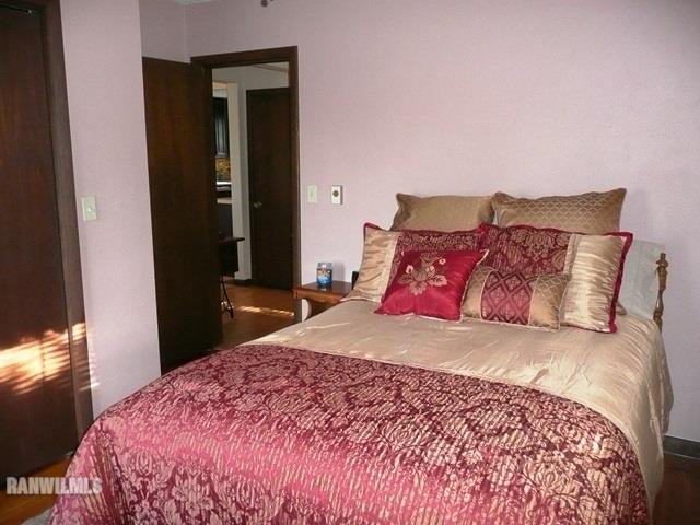 12982 North Bluff Road Baileyville, IL 61007 - Photo 13 of 25 a bedroom with a bed and a mirror