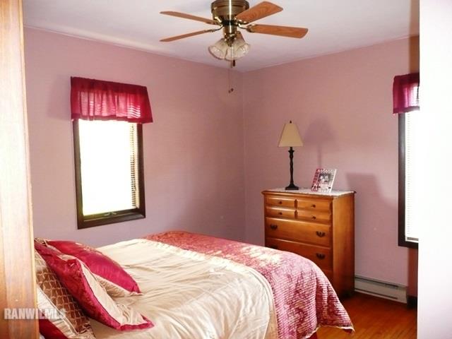 12982 North Bluff Road Baileyville, IL 61007 - Photo 14 of 25 a bedroom with a bed and a dresser