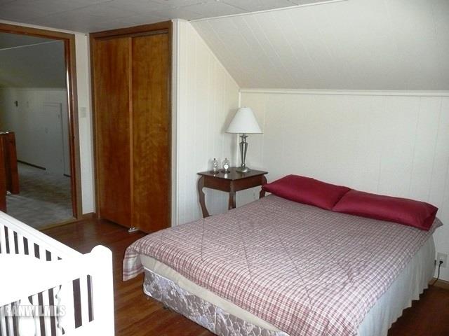 12982 North Bluff Road Baileyville, IL 61007 - Photo 16 of 25 a bedroom with a bed and a lamp