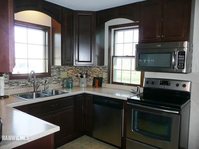 12982 North Bluff Road Baileyville, IL 61007 - Photo 6 of 25 a kitchen with a sink stove and microwave