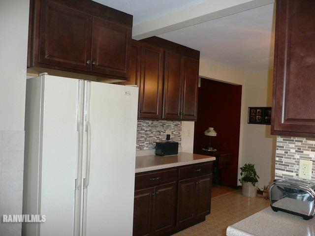 12982 North Bluff Road Baileyville, IL 61007 - Photo 7 of 25 a kitchen with stainless steel appliances granite countertop a refrigerator and a sink