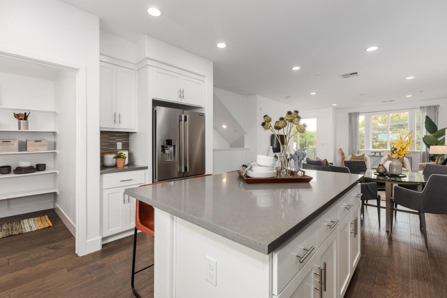 142 Cue Way Hayward, CA 94544 - Photo 11 of 24 a kitchen with stainless steel appliances granite countertop a table chairs stove and refrigerator