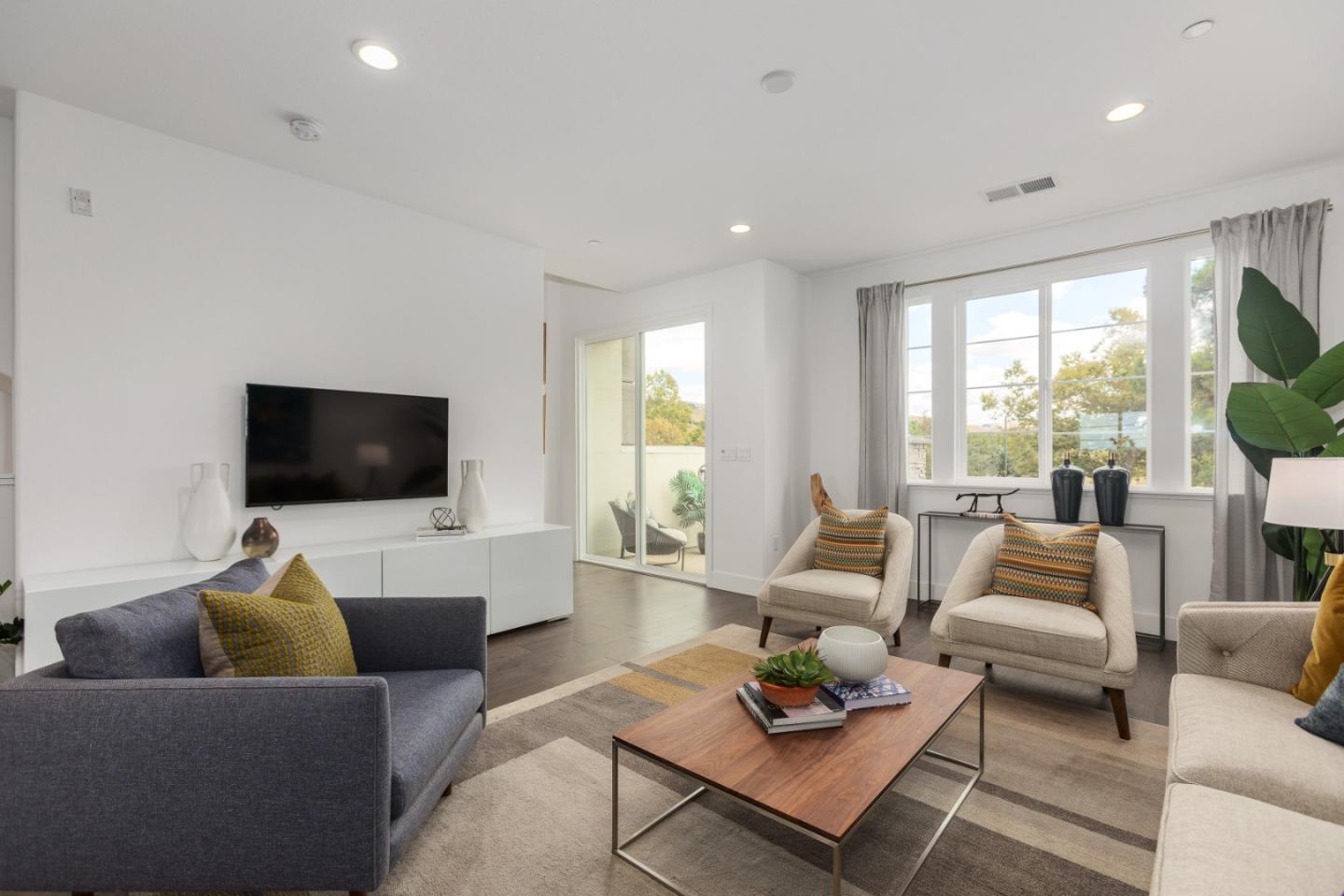 142 Cue Way Hayward, CA 94544 - Photo 13 of 24 a living room with furniture and a flat screen tv