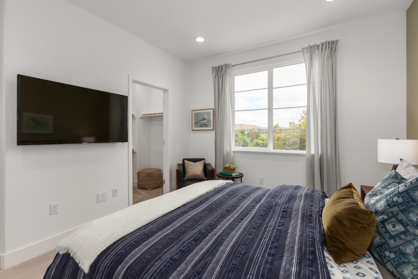 142 Cue Way Hayward, CA 94544 - Photo 23 of 24 a bedroom with a bed tv and window