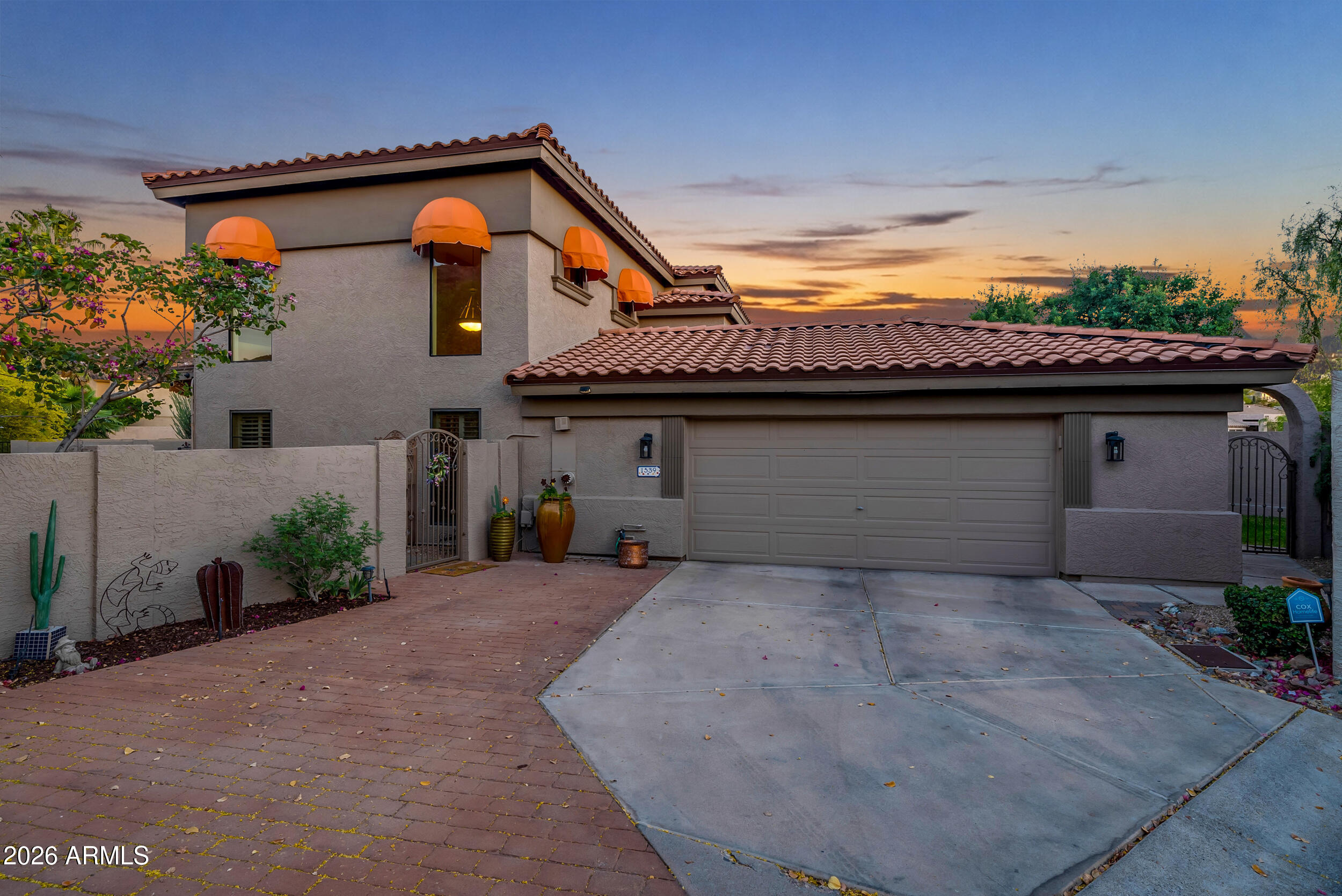 1539 East Winged Foot Road Phoenix, AZ 85022 - Photo 2 of 64 a front view of a house with a garage