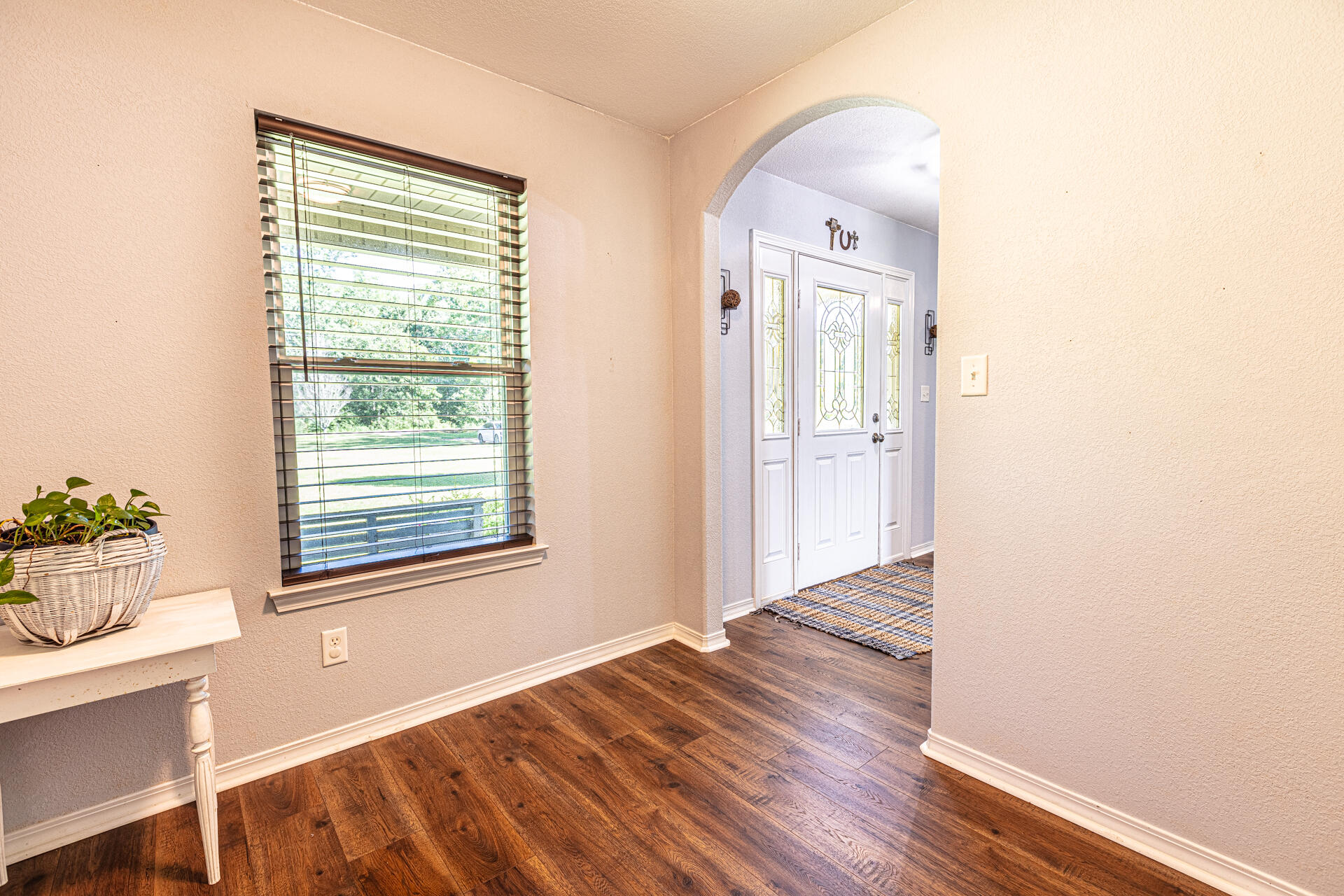 3602 Hazel Godwin Road Jay, FL 32565 - Photo 19 of 46 a view of an empty room with wooden floor and a window