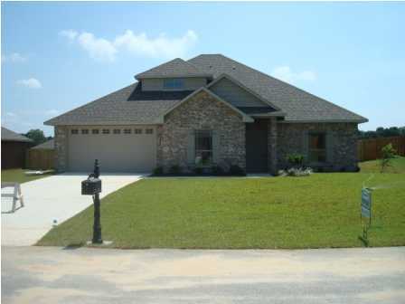 5252 Moore Loop Crestview, FL 32536 - Photo 1 of 28 a front view of a house with a yard