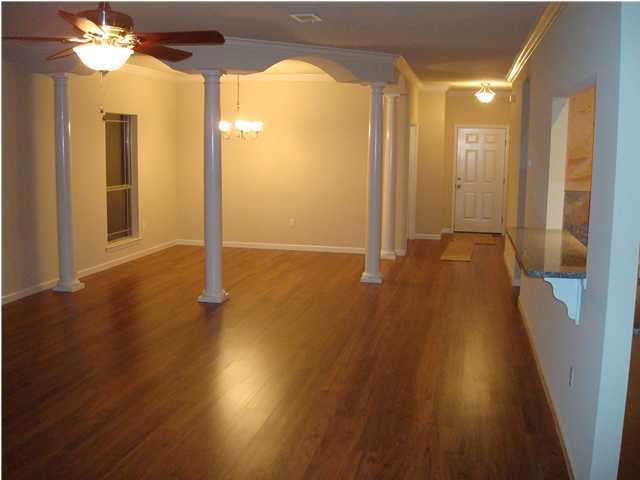 5252 Moore Loop Crestview, FL 32536 - Photo 5 of 28 a view of a hallway with wooden floor