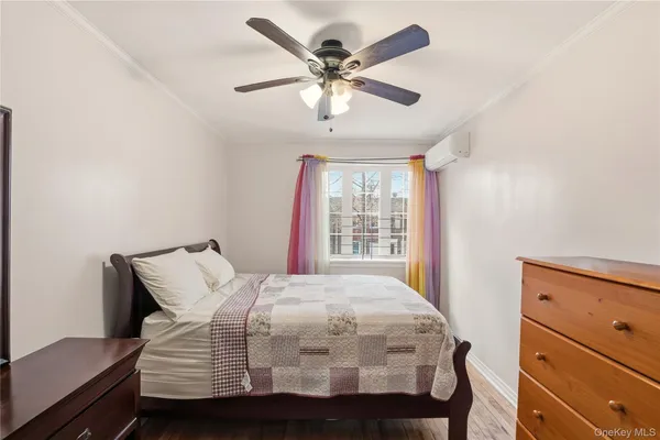 a bedroom with a bed and window