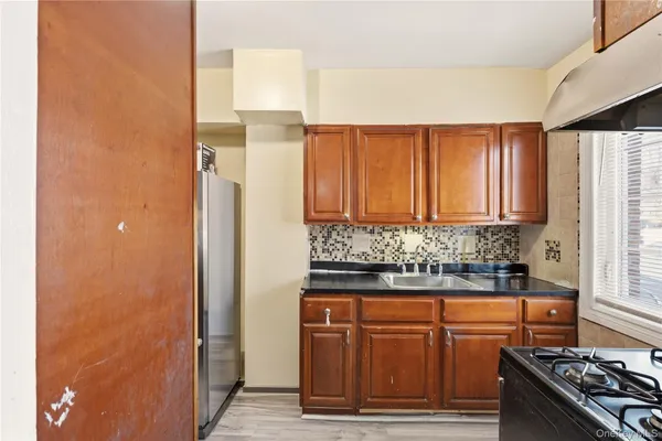 a kitchen with granite countertop cabinets and stainless steel appliances