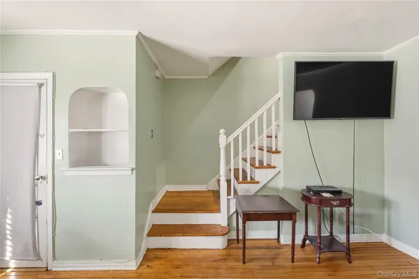 a view of entryway with wooden floor