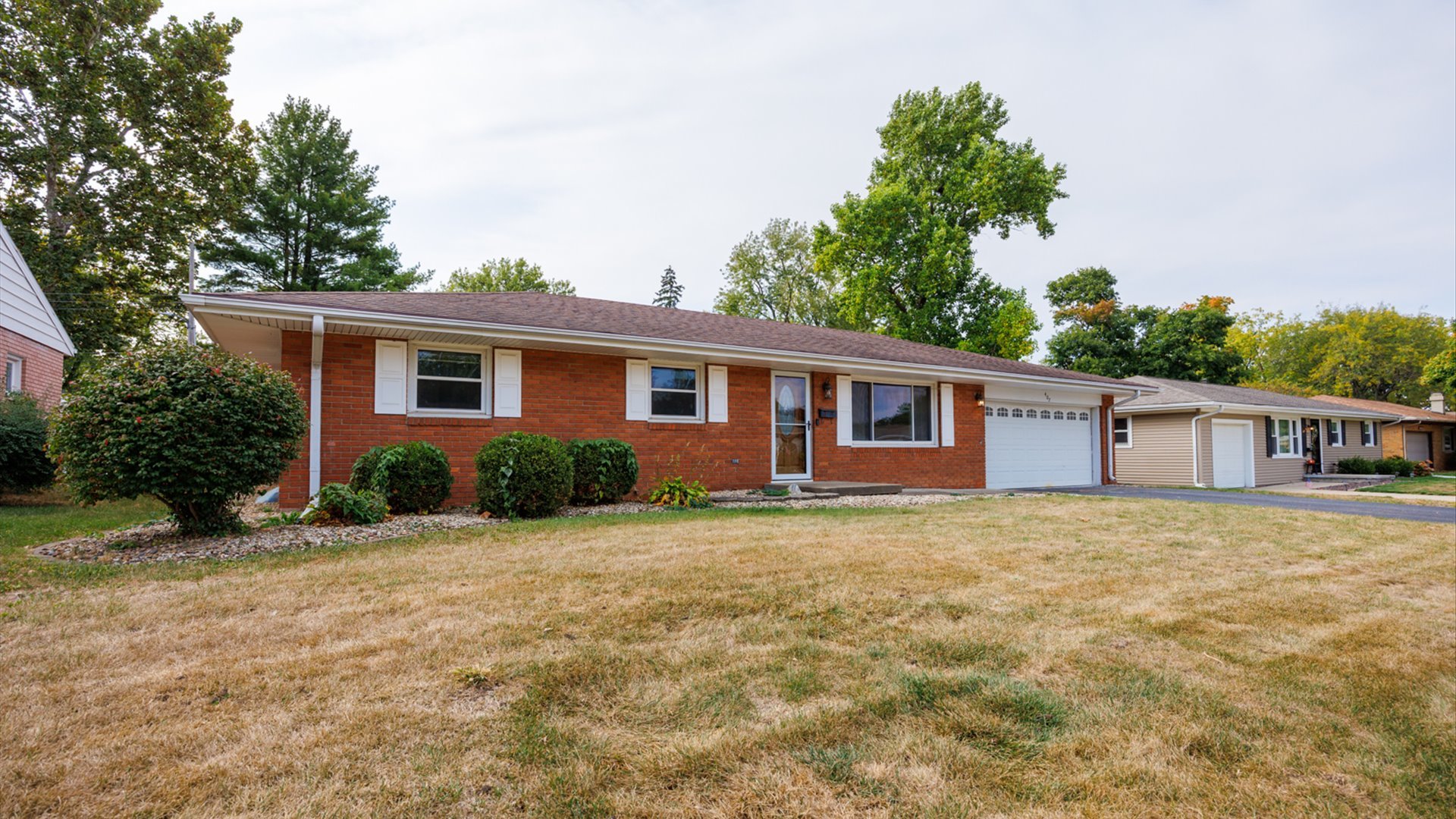 front view of a house with a yard
