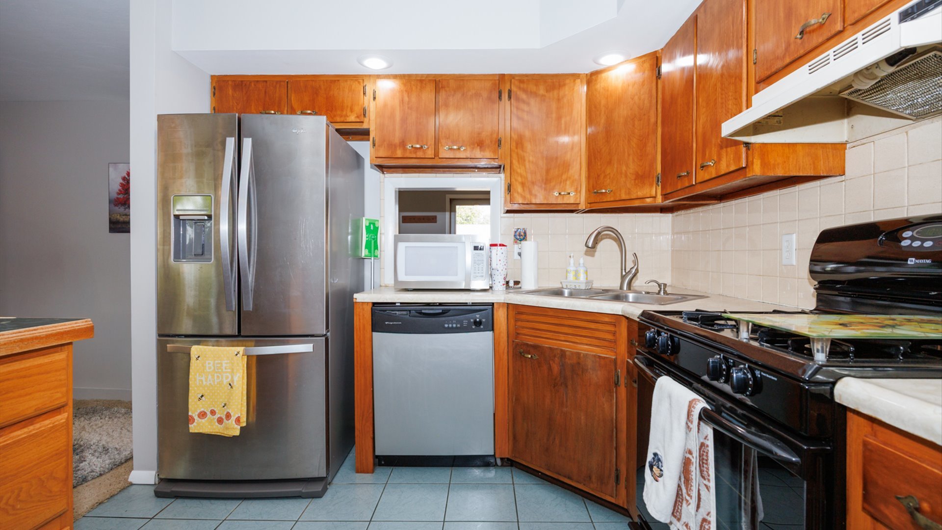 407 Tilden Place Normal, IL 61761 - Photo 7 of 49 a kitchen with stainless steel appliances granite countertop a refrigerator and a stove