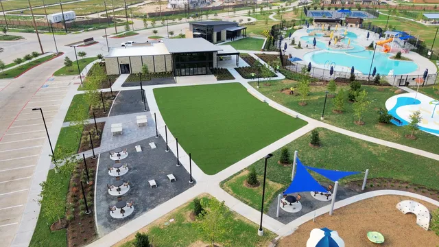 a swimming pool with view of lake in the back