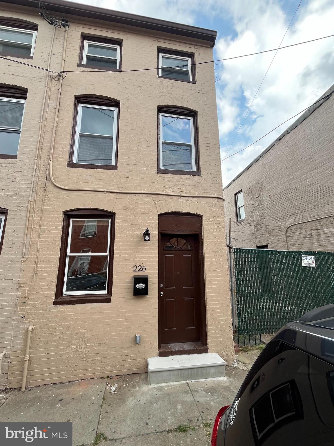226 South Regester Street Baltimore, MD 21231 - Photo 1 of 17 a front view of a house with parking space