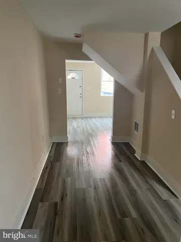 a view of wooden floor in an empty room