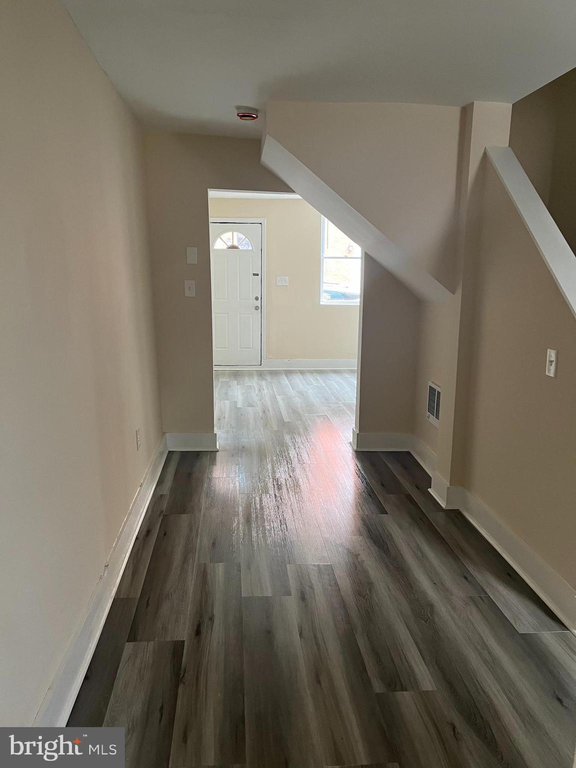 226 South Regester Street Baltimore, MD 21231 - Photo 8 of 17 a view of wooden floor in an empty room