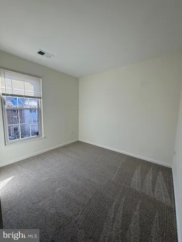 a bathroom with a sink a toilet mirror and vanity