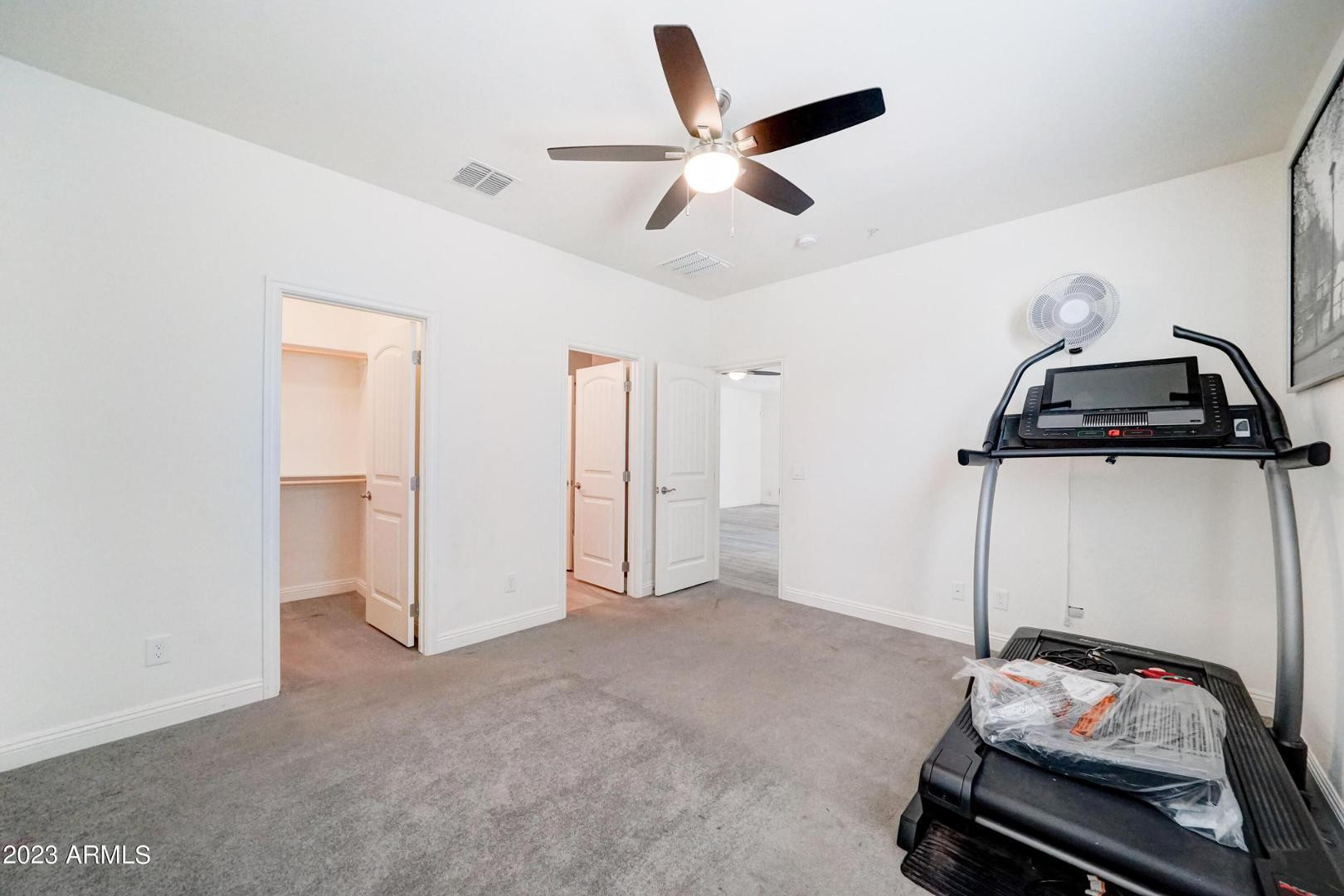 2297 North Alsap Road Buckeye, AZ 85396 - Photo 25 of 36 a view of a room with gym equipment
