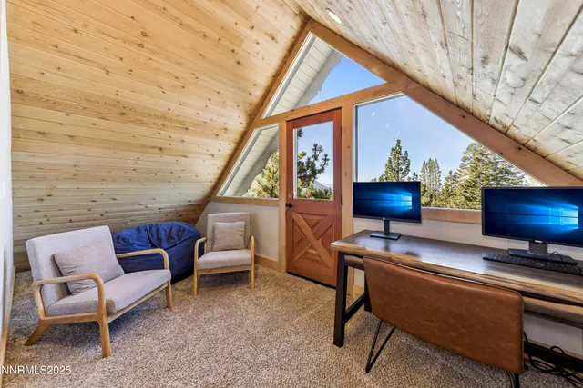 a living room with furniture a flat screen tv and a wall