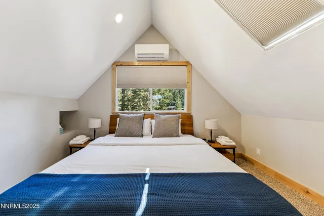 a bed room with a bed and a window