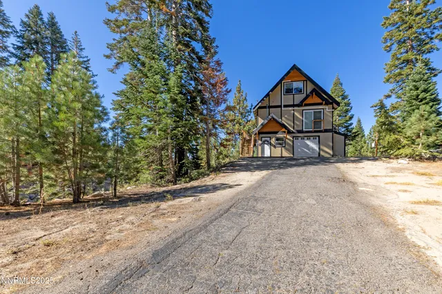 a front view of a house with garage