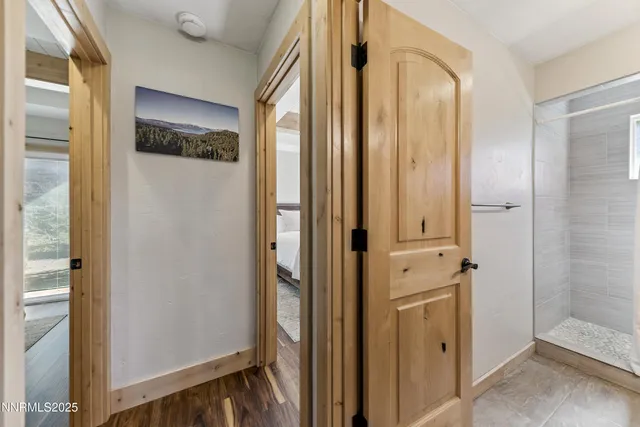 a view of a bathroom with a shower and closet