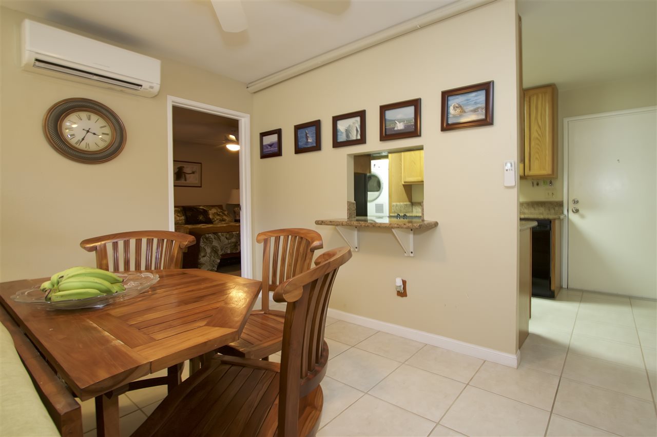 2219 South Kihei Road, Unit B102 Kihei, HI 96753 - Photo 14 of 30 a view of a dining room with furniture and wooden floor